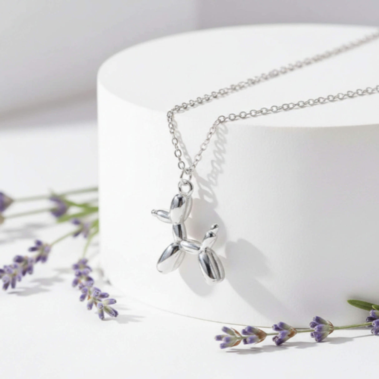 Balloon dog pendant necklace, jewellery at Lotte of London, close up image