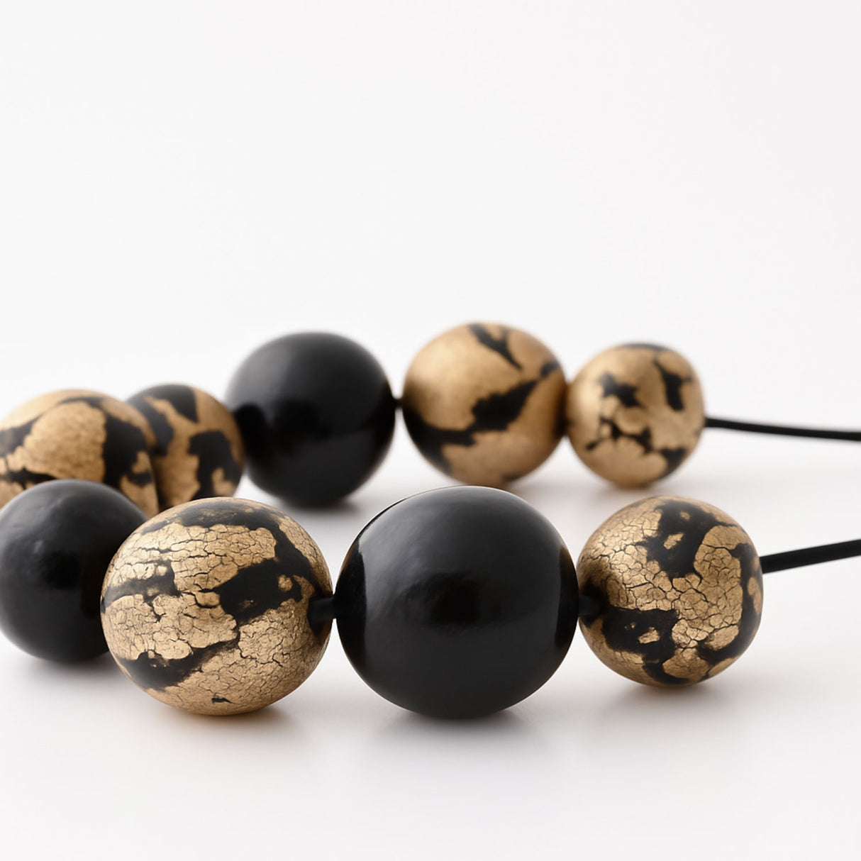 black and gold statement necklace close up - handmade at lottie of london jewellery