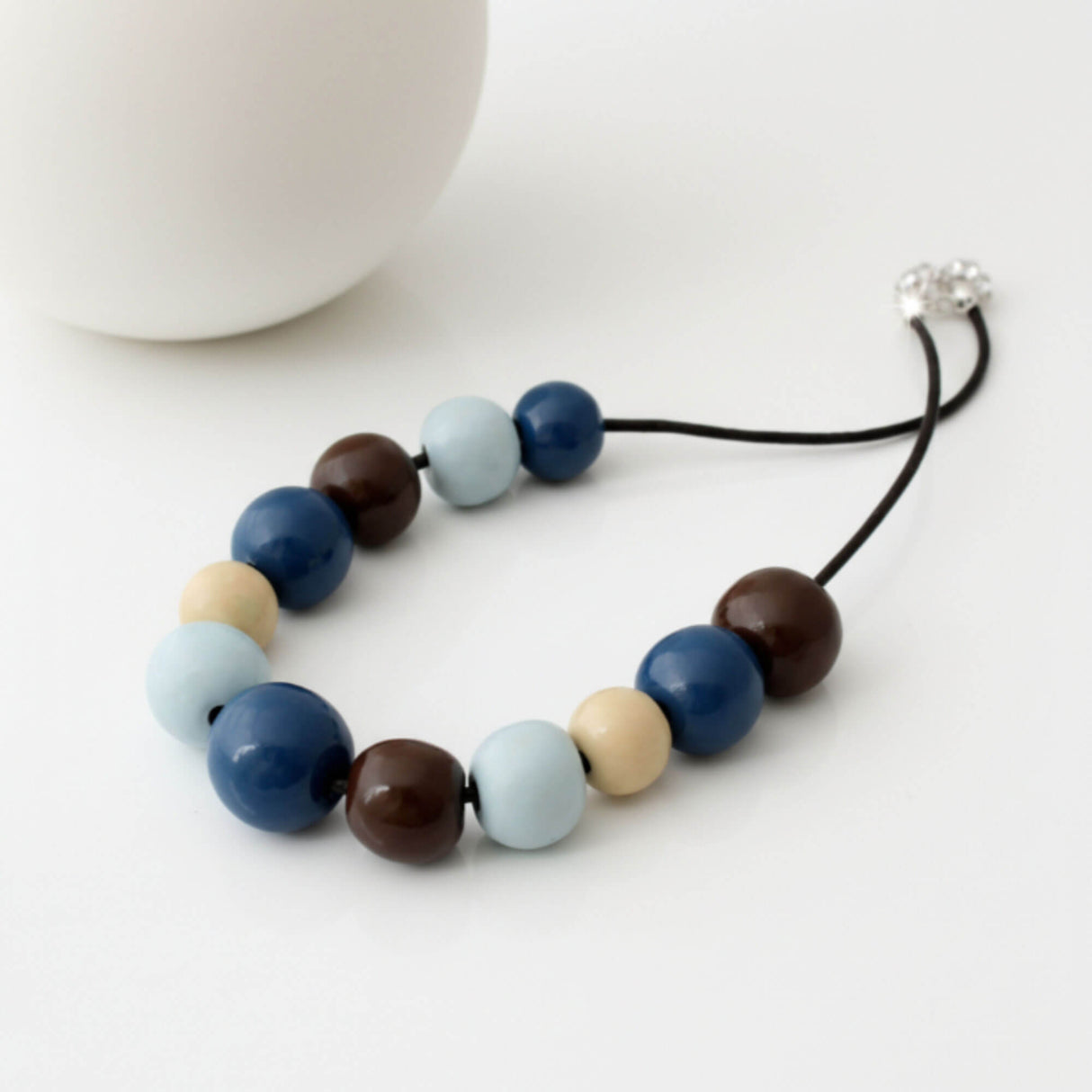 blue chunky statement necklace, handmade clay jewellery at lottie of london, lifestyle image