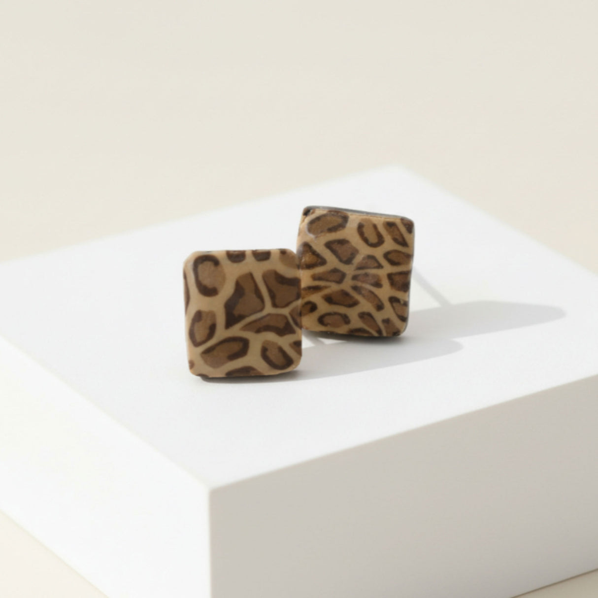 Animal print square stud earrings on plinth, handmade at Lottie Of London