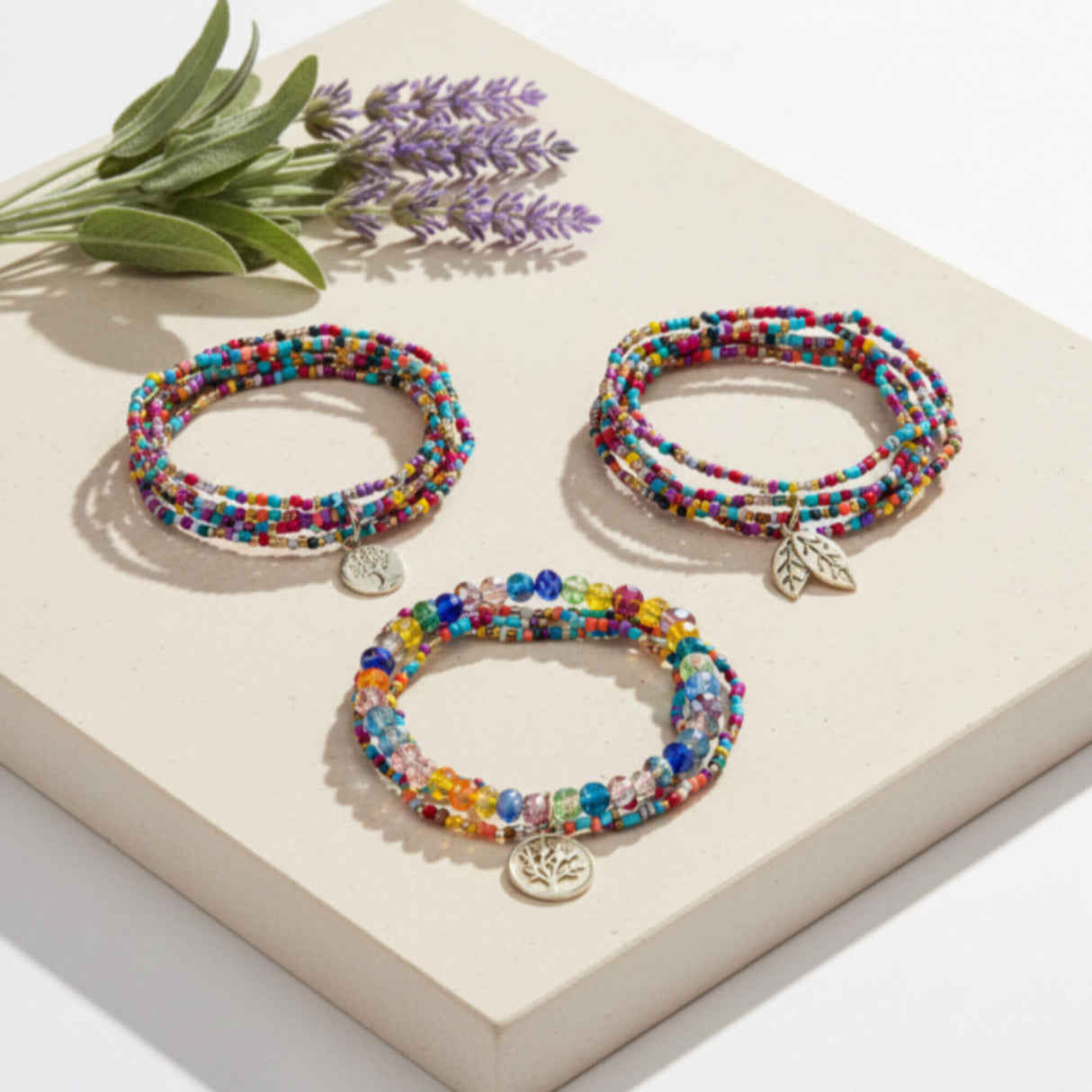 Multi-Colour Beaded Bracelet Stack with Gold Charms – lifestyle image - Layered Bracelet Set - Lottie Of London Jewellery