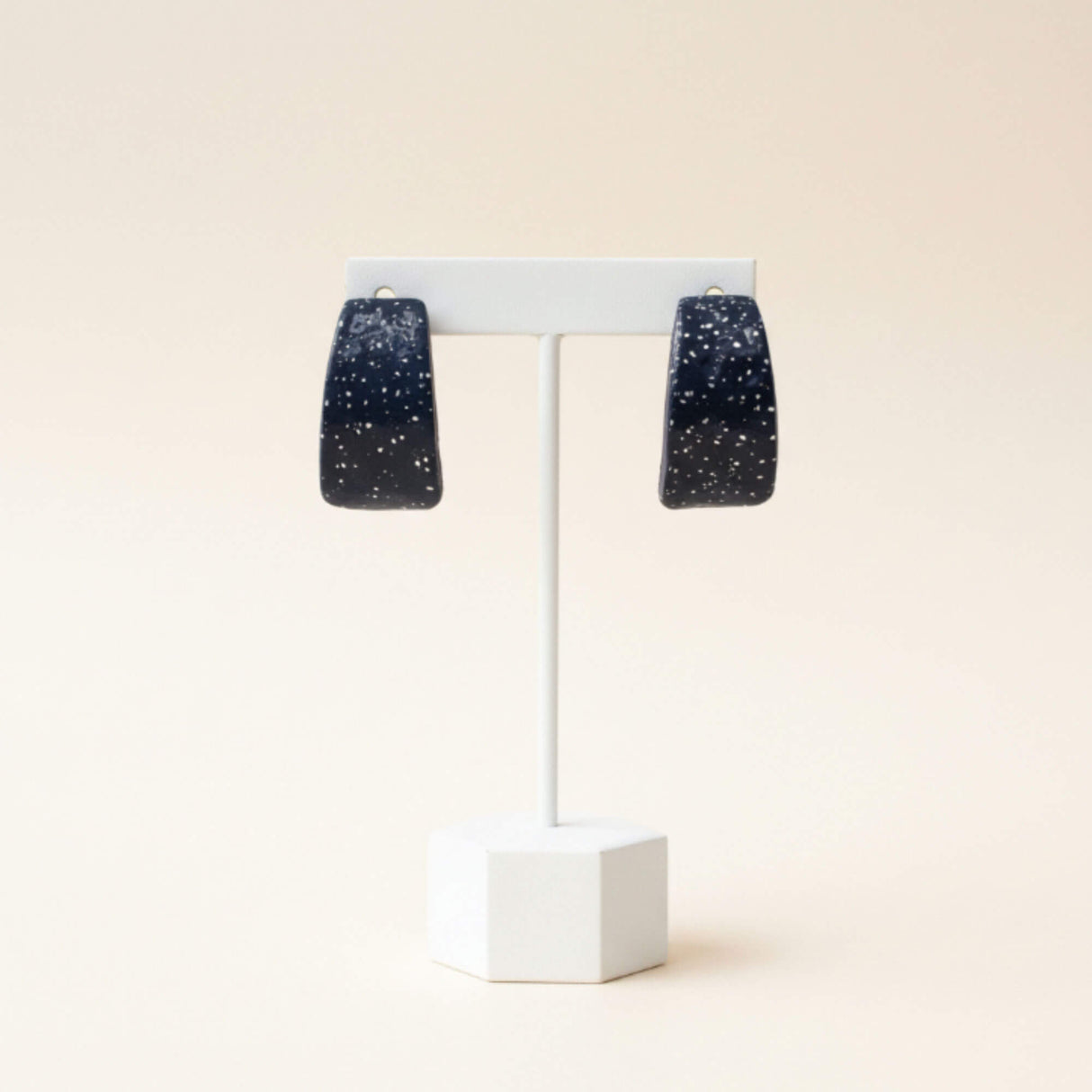 navy blue clay hoop earrings on earring stand, handmade at lottie of london