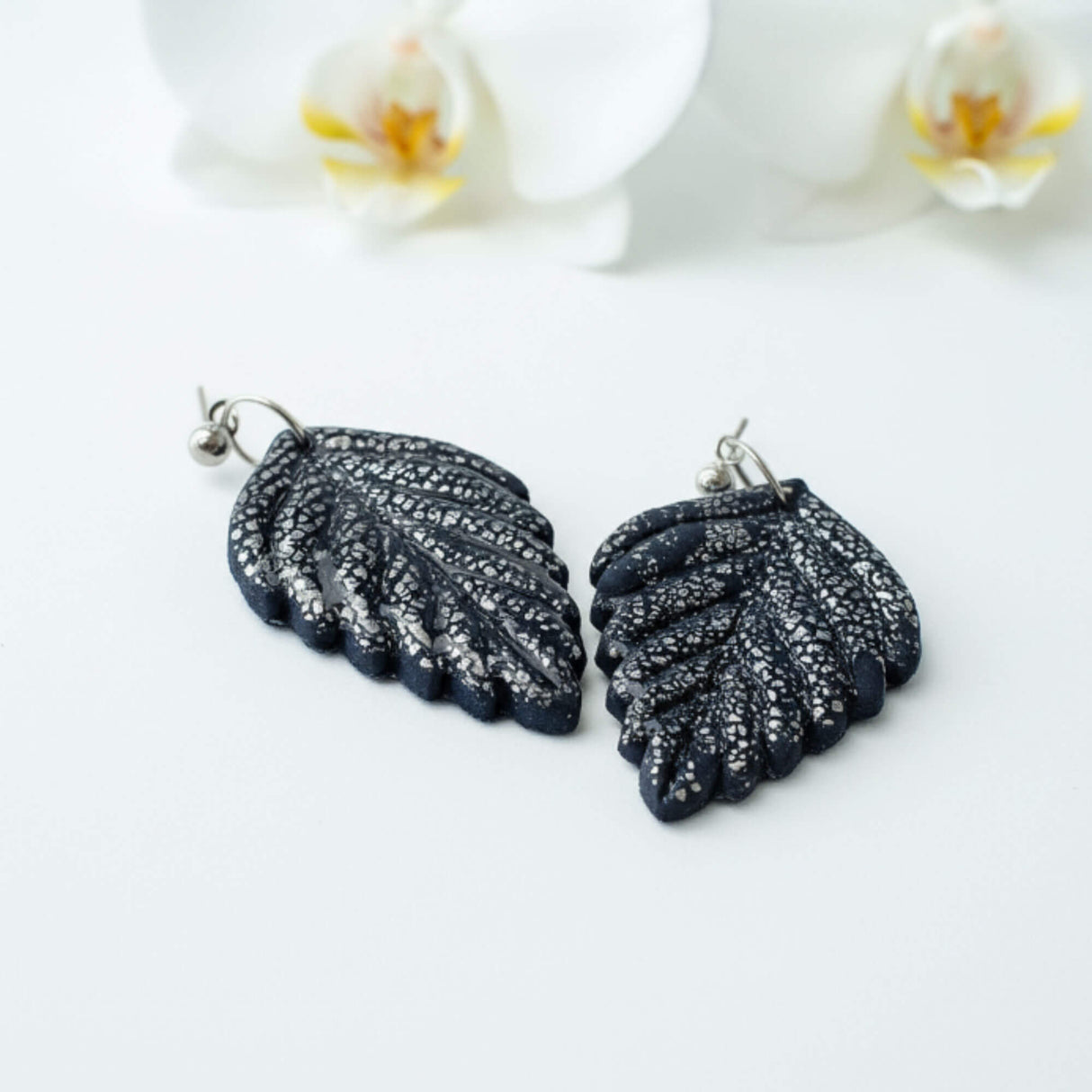 Navy and silver leaf drop earrings at lottie of london