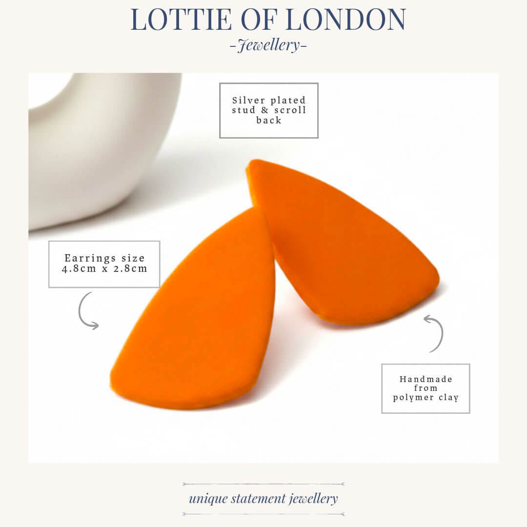 Bright orange clay statement earrings with silver-plated studs and scroll backs, shown on a white background with text callouts detailing the size and materials. The brand name 'Lottie of London' is displayed at the top.