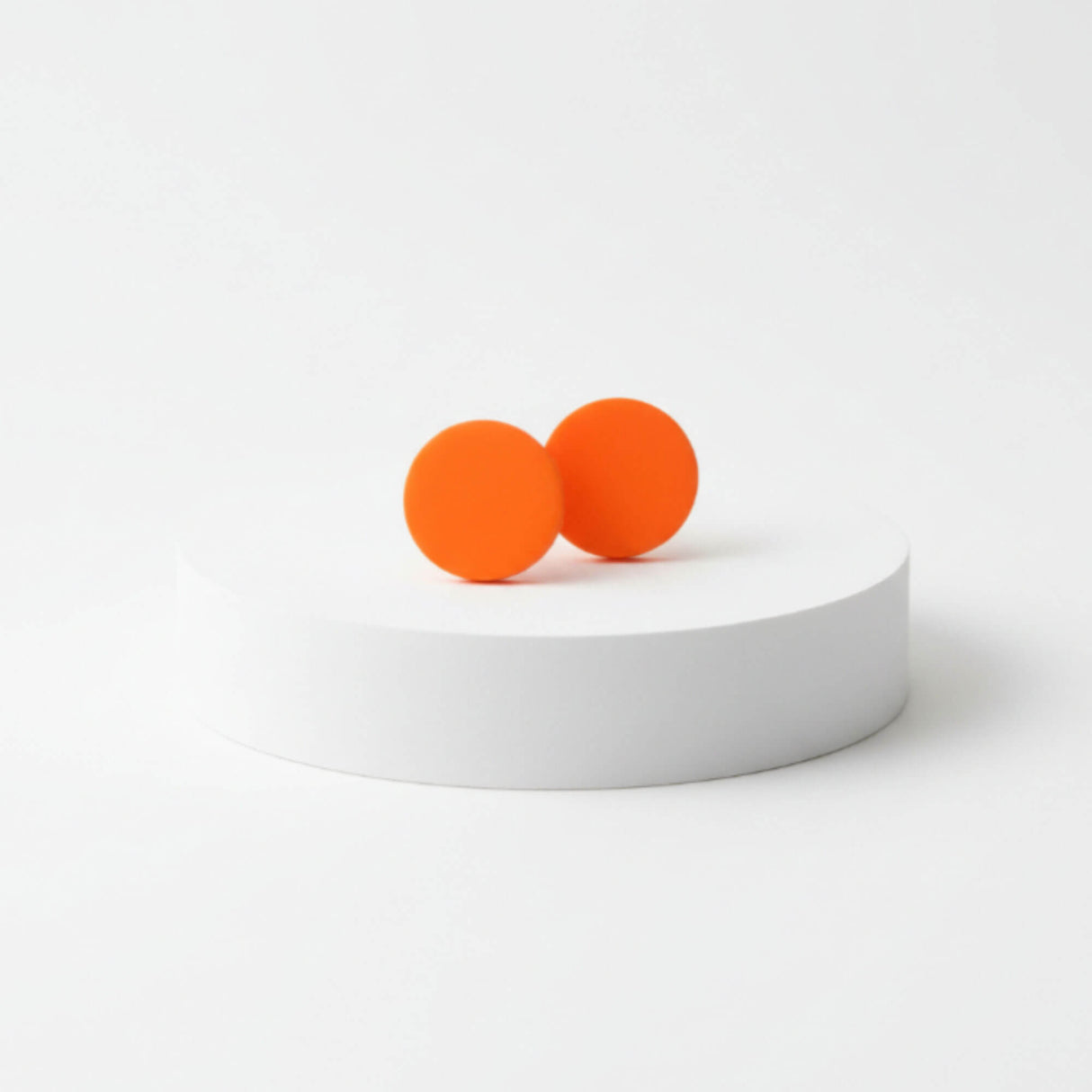 handmade orange clay stud earrings lifestyle at lottie of london