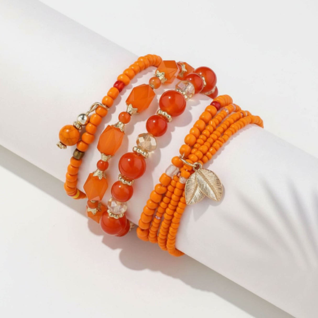 Orange bracelet stack at lottie of london uk