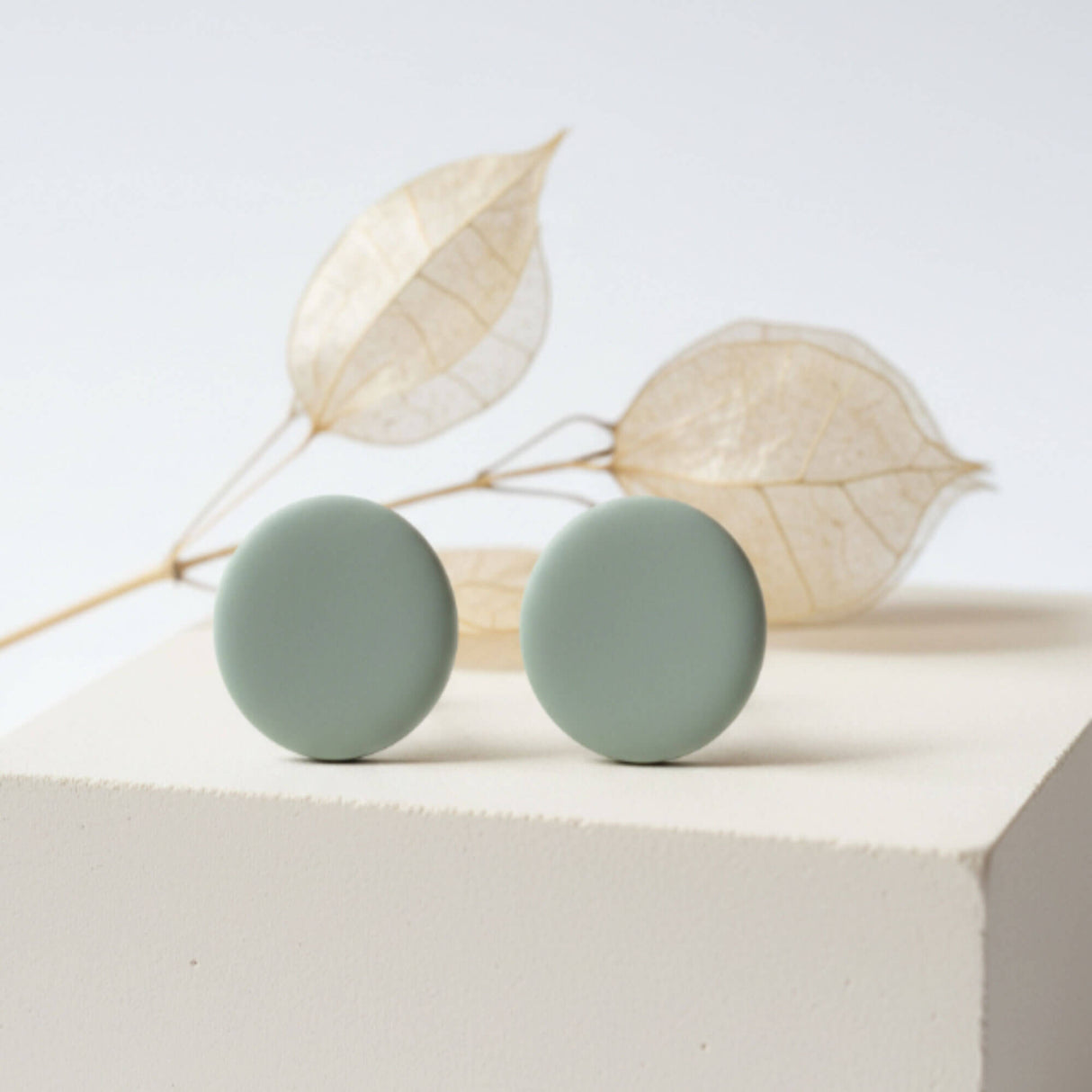 sage green stud earrings lifestyle handmade clay jewellery at Lottie of london