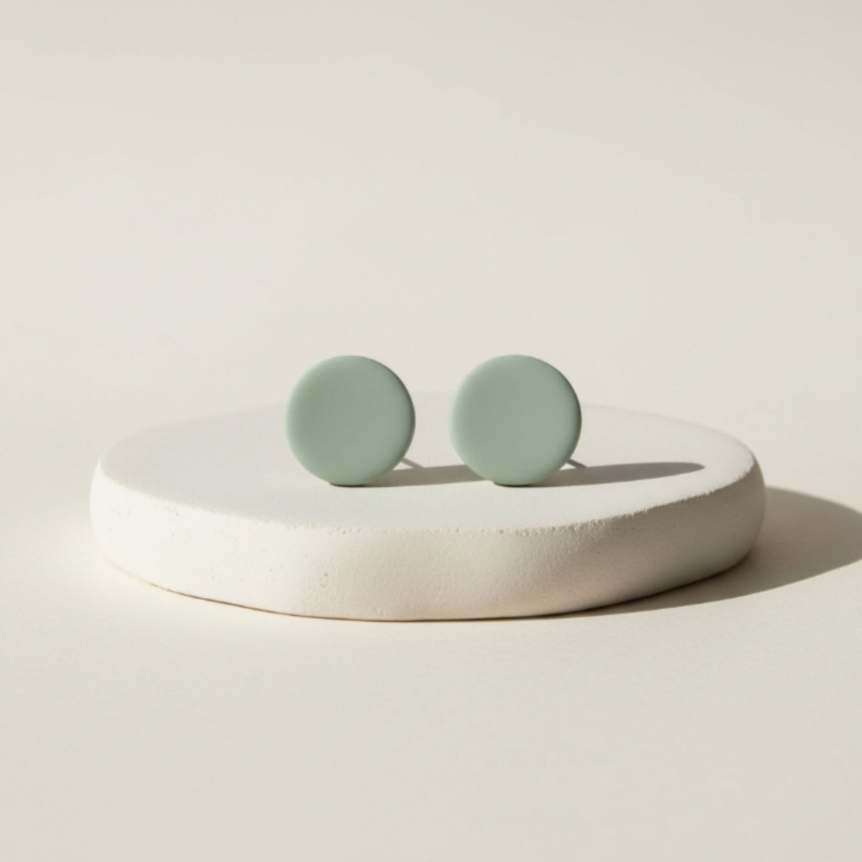 sage green clay stud earrings lifestyle handmade jewellery at Lottie of london