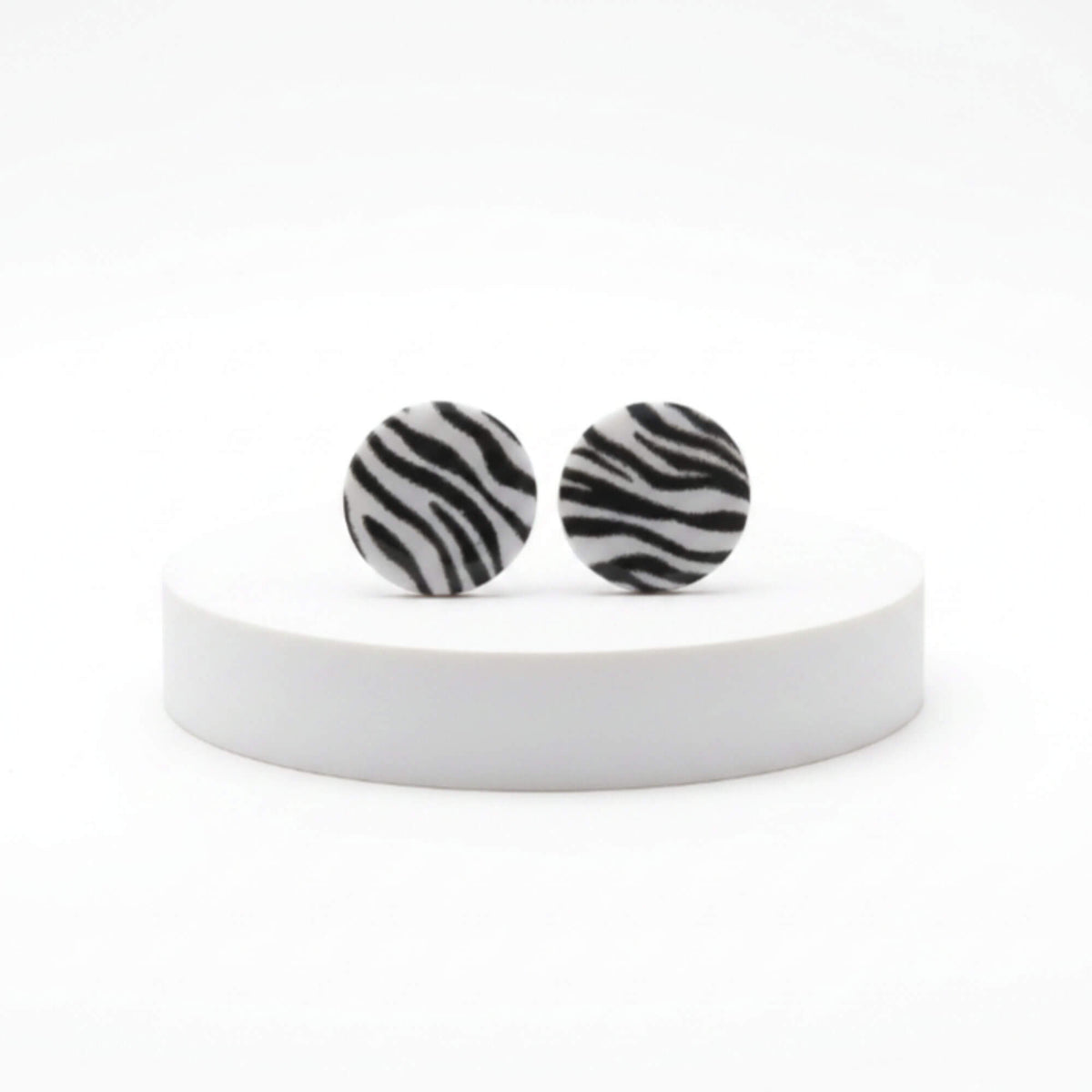 animal print stud earrings, handmade clay jewellery at Lottie of London, lifestyle image