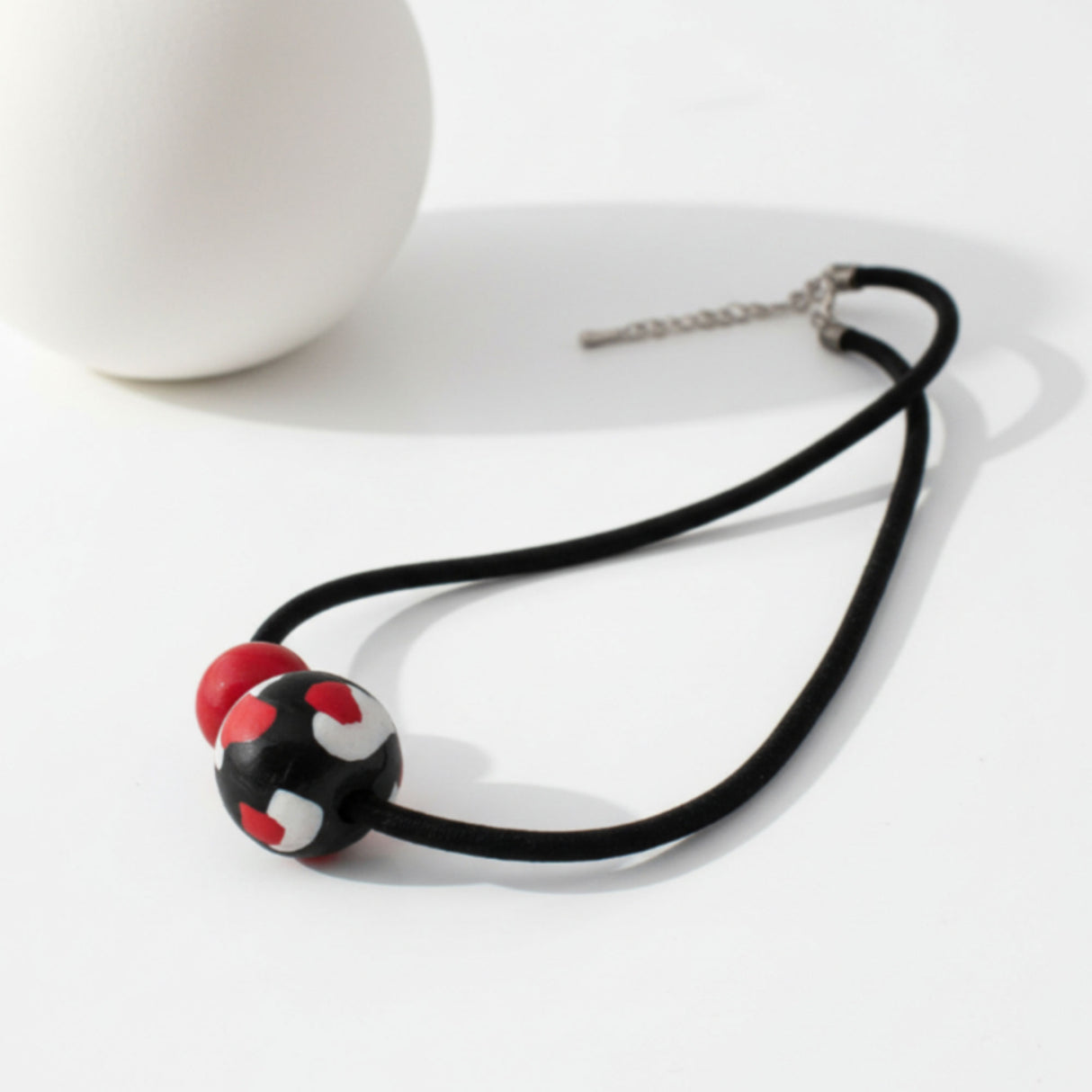black red clay bead necklace, lifestyle image, jewellery at lottie of london