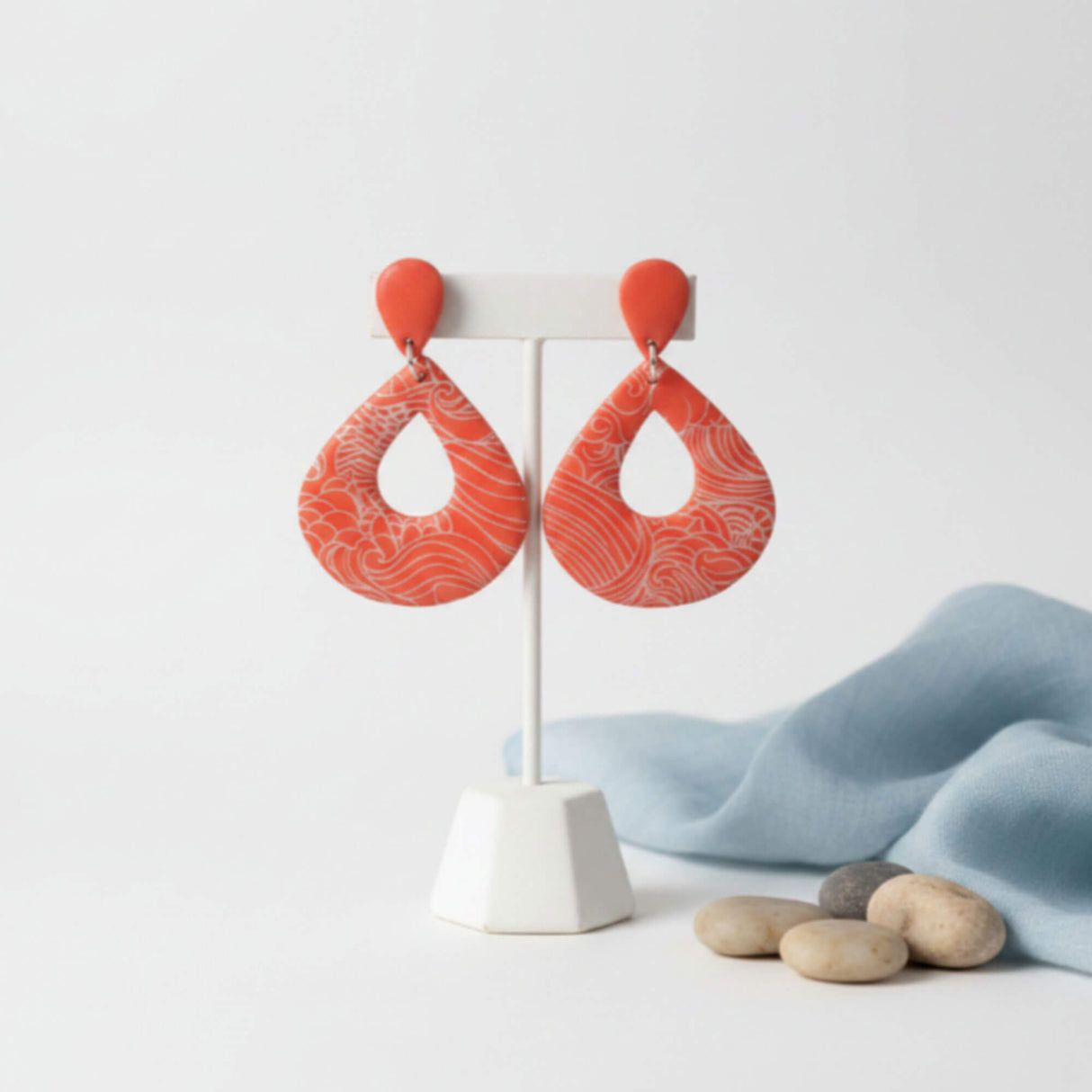orange statement teardrop earrings on earrings stand - handmade jewellery at lottie of london 