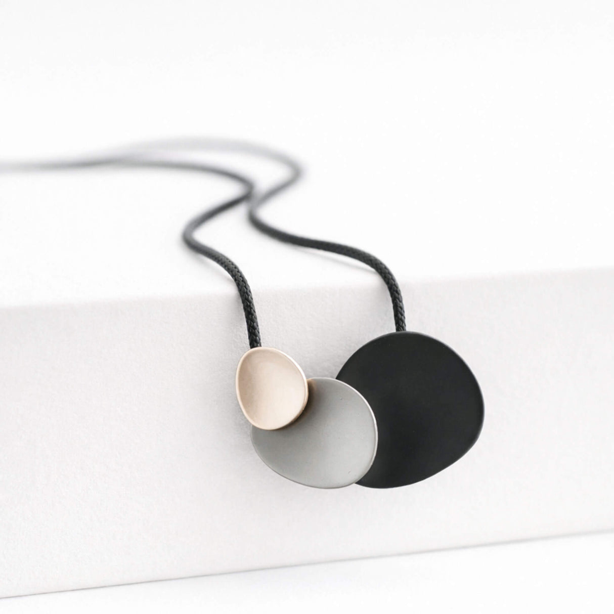 abstract pendant necklace, contemporary jewellery at Lotte of London, lifestyle image