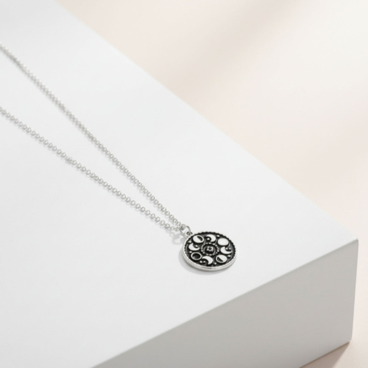 black enamel moon phase necklace 