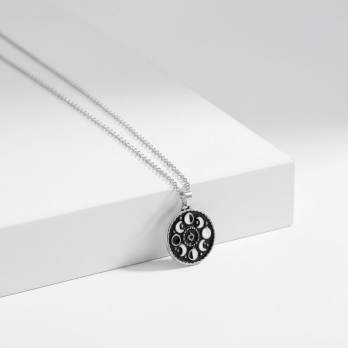 black enamel moon phase pendant