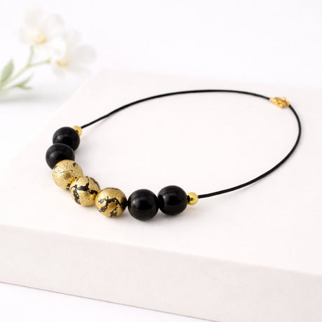 black and gold clay bead necklace handmade at Lottie of London jewellery