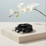 black beaded stacking bracelet with charms at Lottie Of London