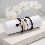 black and gold stacking bracelet, lifestyle image, Lottie of London jewellery