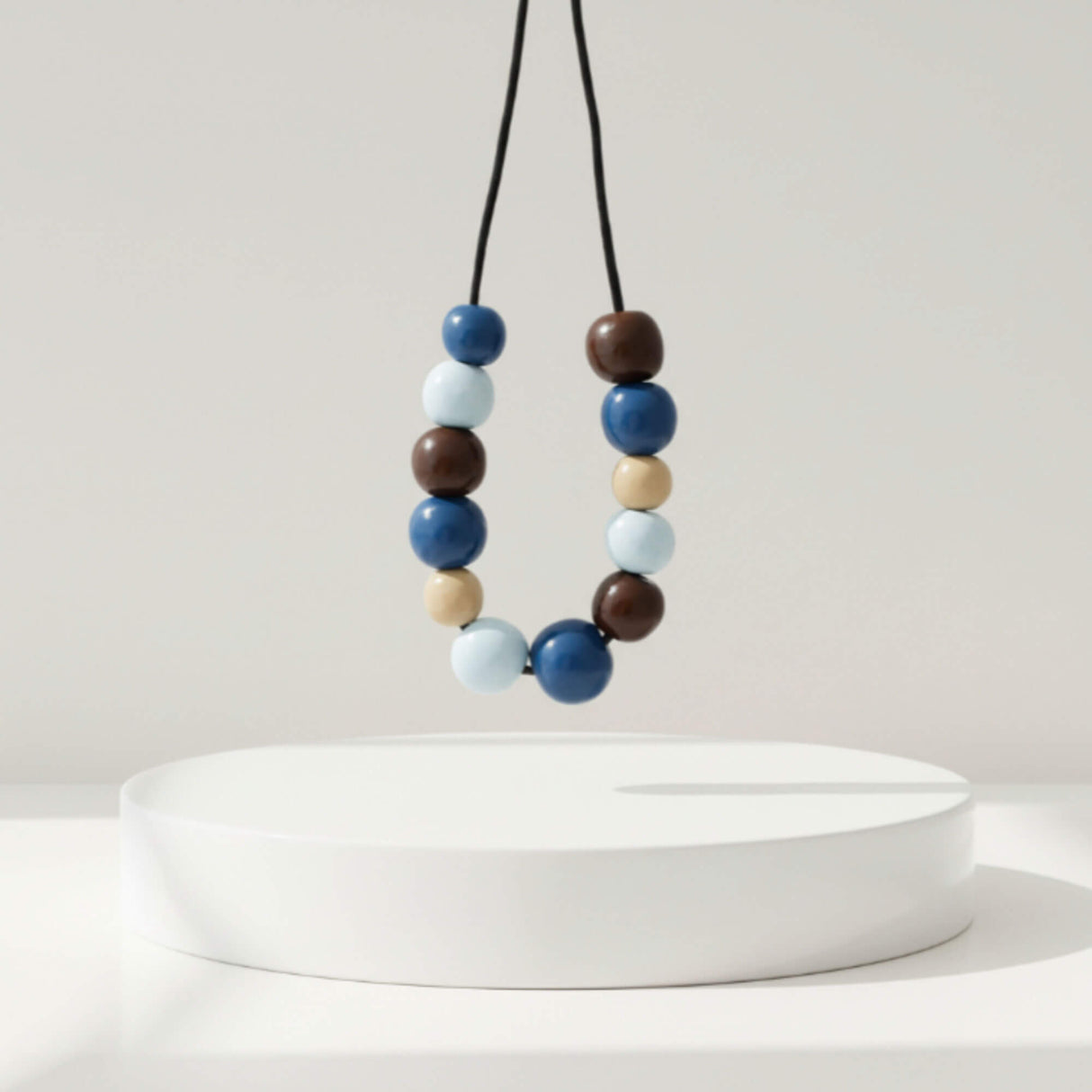 blue & brown chunky statement necklace, handmade clay jewellery at lottie of london, lifestyle image