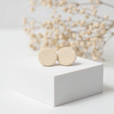 small cream stud earrings on plinth, handmade clay jewellery at lottie of london