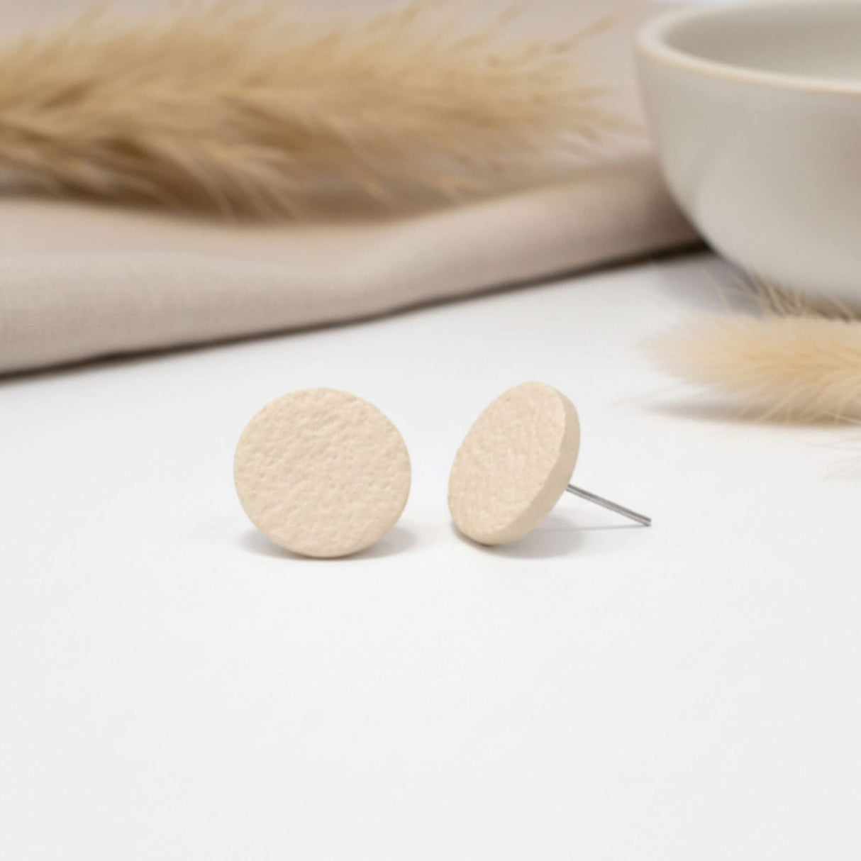 cream stud earrings, lifestyle image, handmade clay jewellery at lottie of london