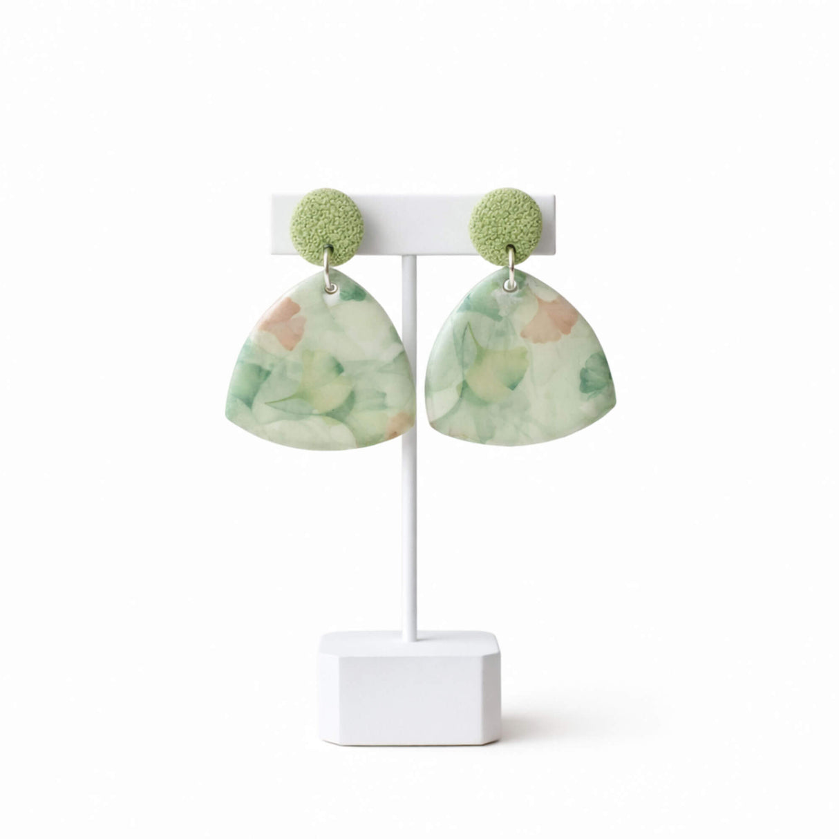 green floral drop earrings on earring stand, handmade clay jewellery at lottie of london