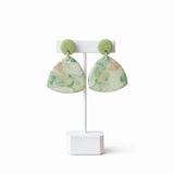 green floral drop earrings on earring stand, handmade clay jewellery at lottie of london
