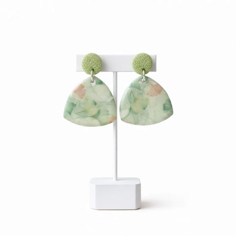 green floral drop earrings on earring stand, handmade clay jewellery at lottie of london