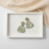 Green drop earrings, flat lay image, handmade jewellery at lottie of london