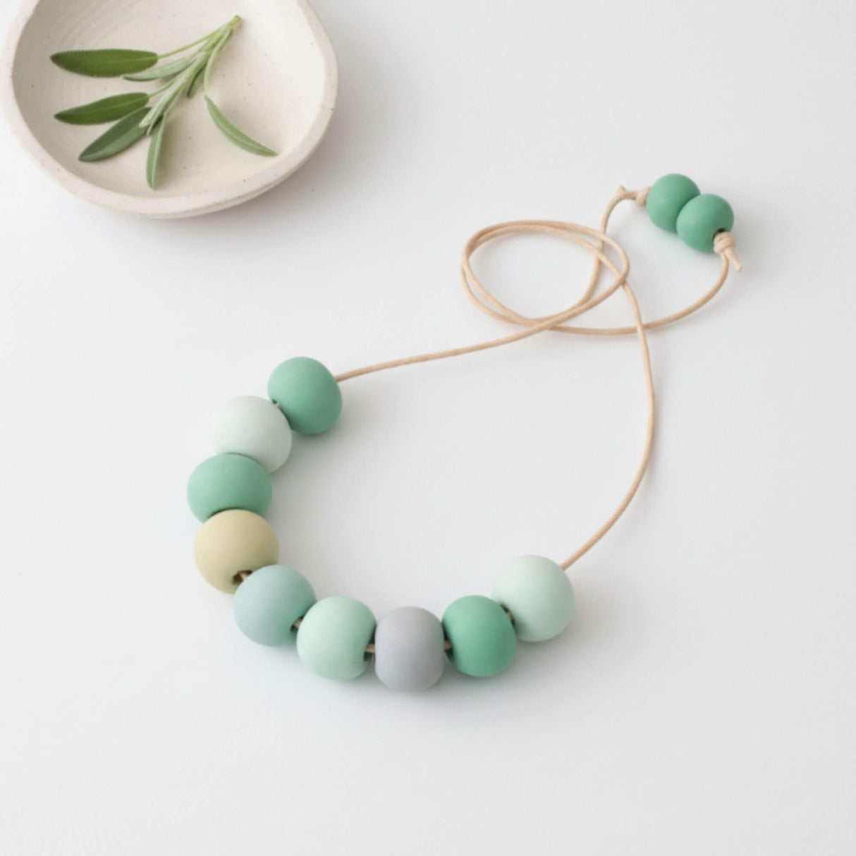 Long Bead Necklace in Green - flat lay image - Lottie Of London Jewellery