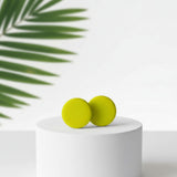 bright yellow stud earrings, handmade clay jewellery at lottie of london, lifestyle image 