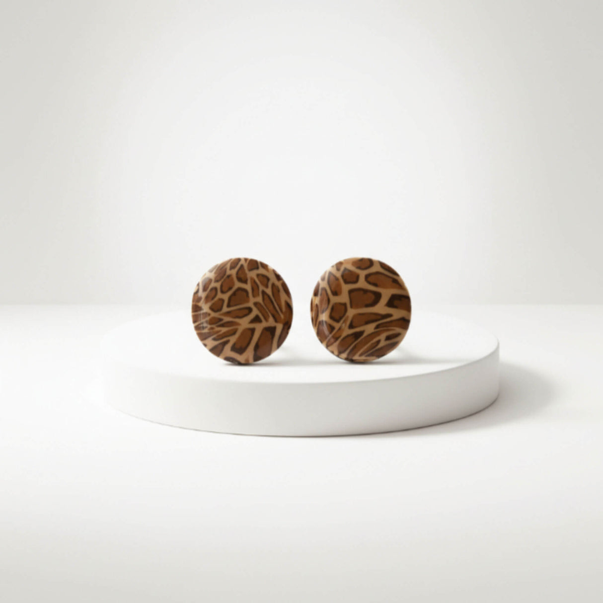leopard print small stud earrings on plinth, handmade at Lottie Of London