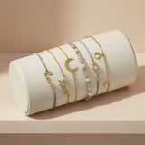 Moon and stars stacking bracelet lifestyle at Lottie Of London