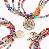 Multi-Colour Beaded Bracelet Stack with Gold Charms – Layered Bracelet Set - close up - Lottie Of London Jewellery