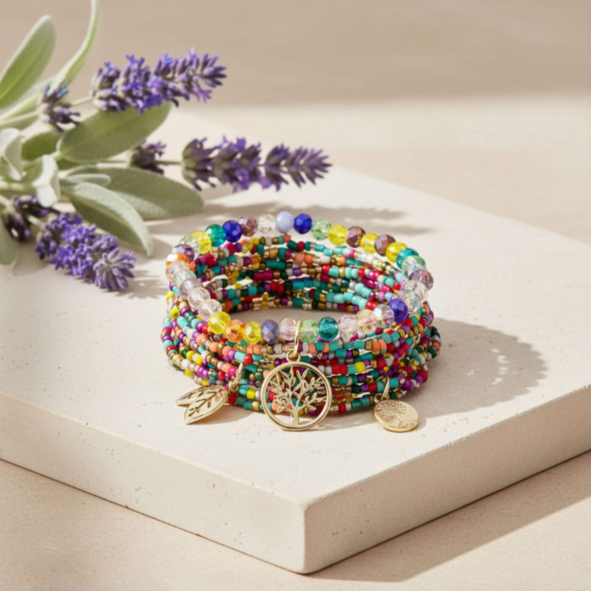 Multi-Colour Beaded Bracelet Stack with Gold Charms  styled image – Layered Bracelet Set - Lottie Of London Jewellery