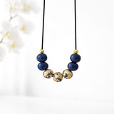 navy blue and gold bead necklace lifestyle handmade at lottie of london