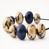 navy and gold leaf chunky necklace close up at Lottie Of London