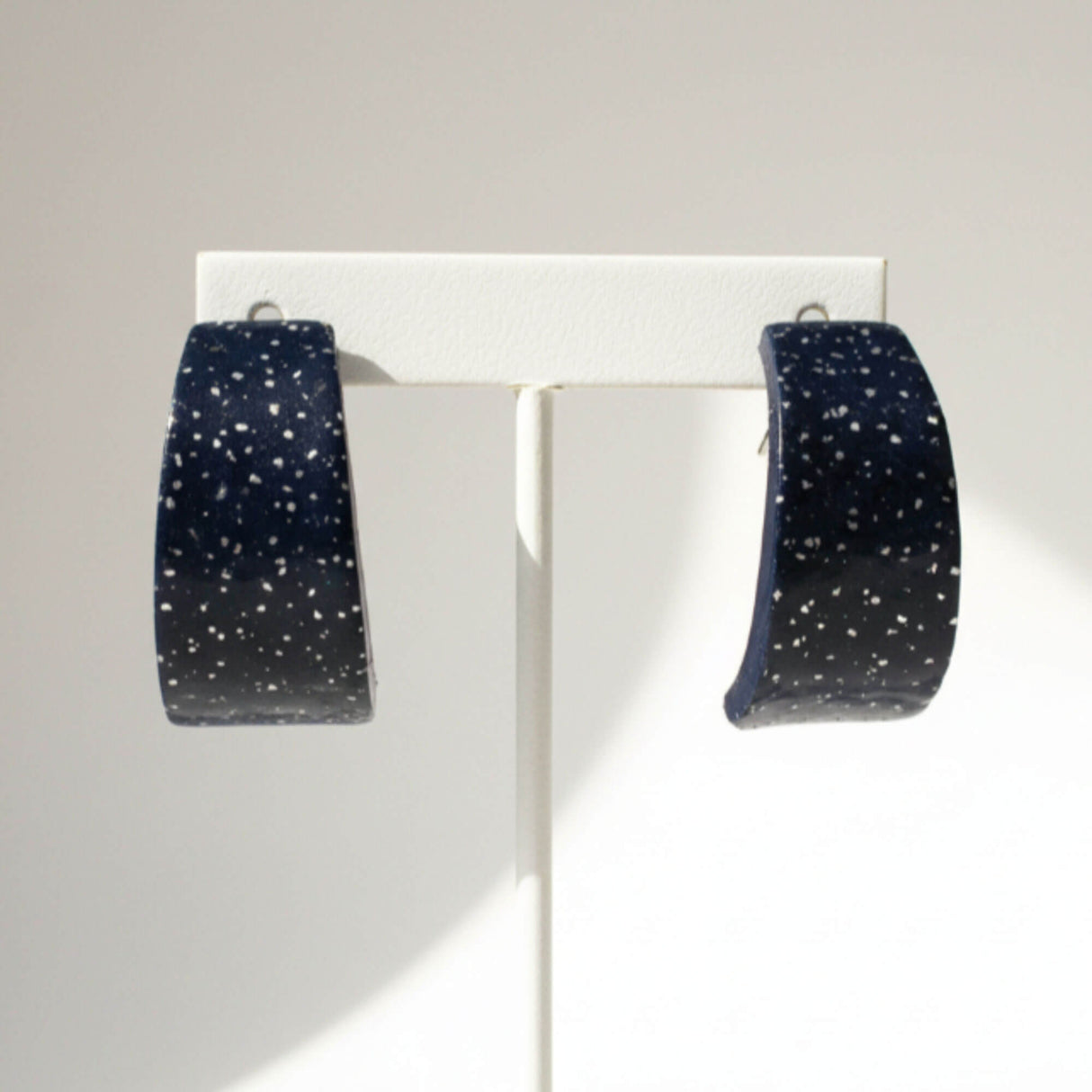 navy huggie earrings close up,  handmade at lottie of london