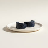 navy blue huggie hoop earrings, flat lay in dish, handmade at lottie of london