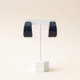 navy blue clay hoop earrings on earring stand, handmade at lottie of london