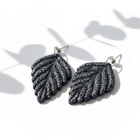 Navy and silver leaf drop earrings at lottie of london 