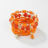 Orange bracelet stack at lottie of london uk