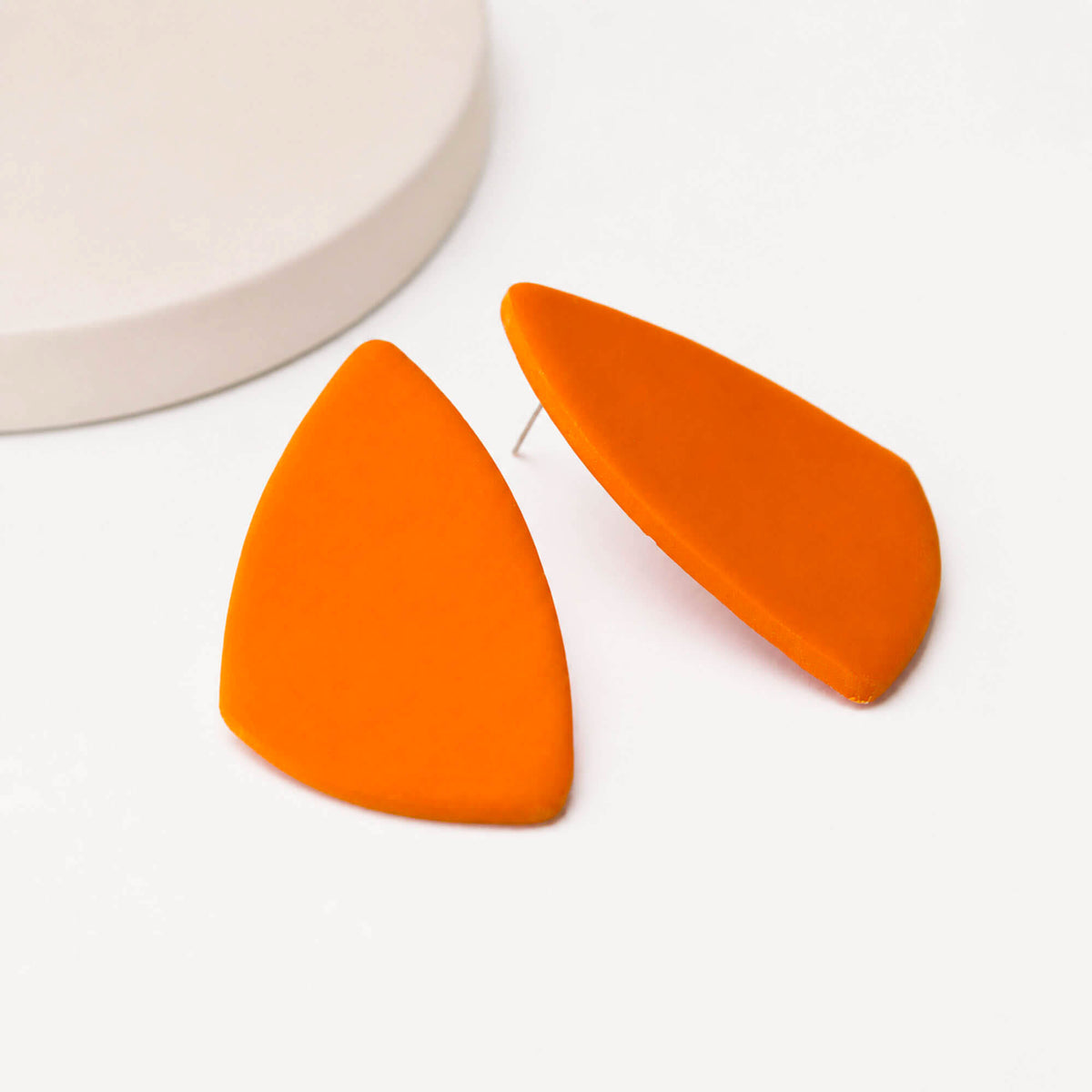 large orange statement stud earrings,  handmade clay jewellery at Lottie of London, lifestyle image
