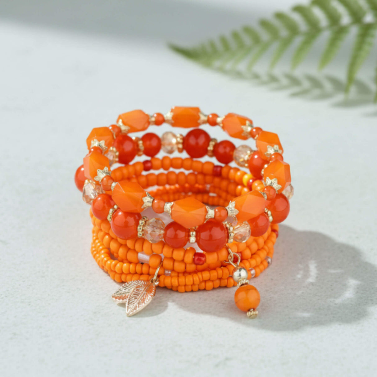 Orange stacking bracelet lifestyle at lottie of london uk