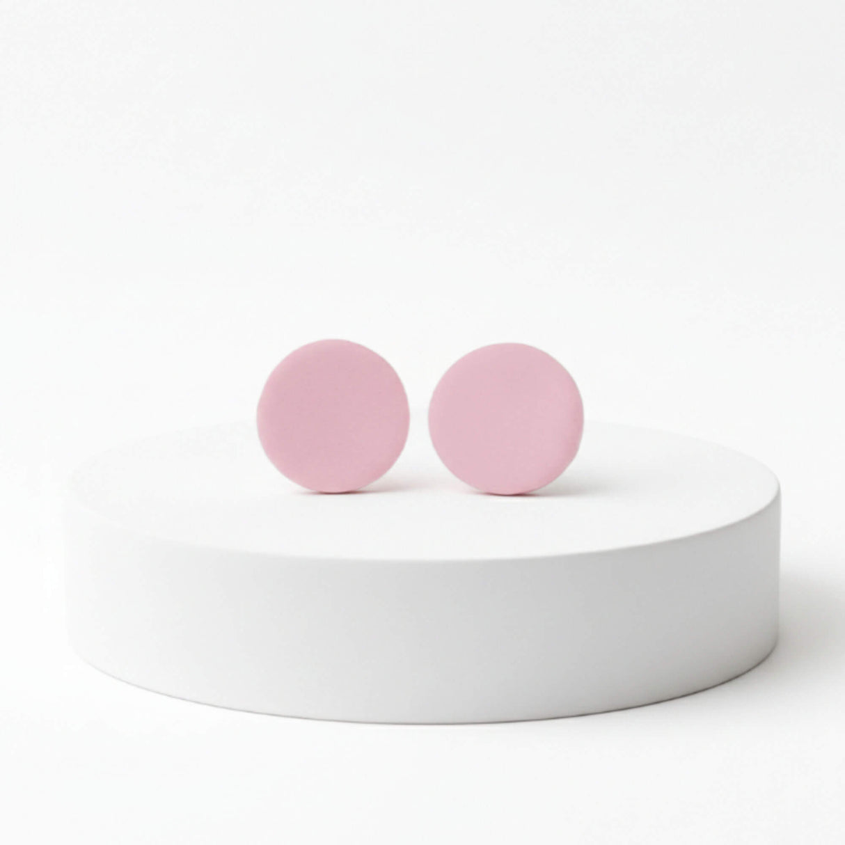 pale pink stud earrings, handmade clay jewellery at Lottie of London, lifestyle image