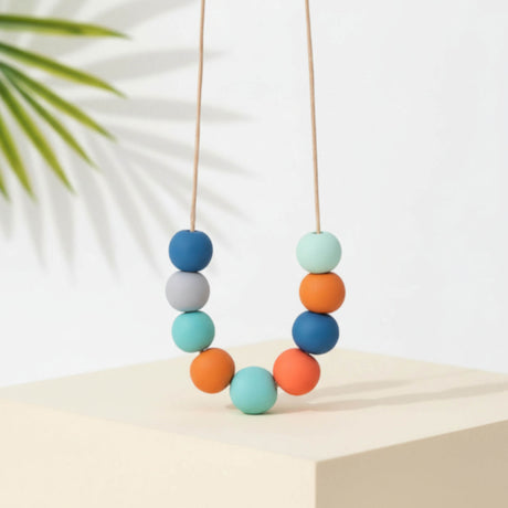 turquoise and orange long adjustable bead necklace handmade at lottie of london - lifestyle shot
