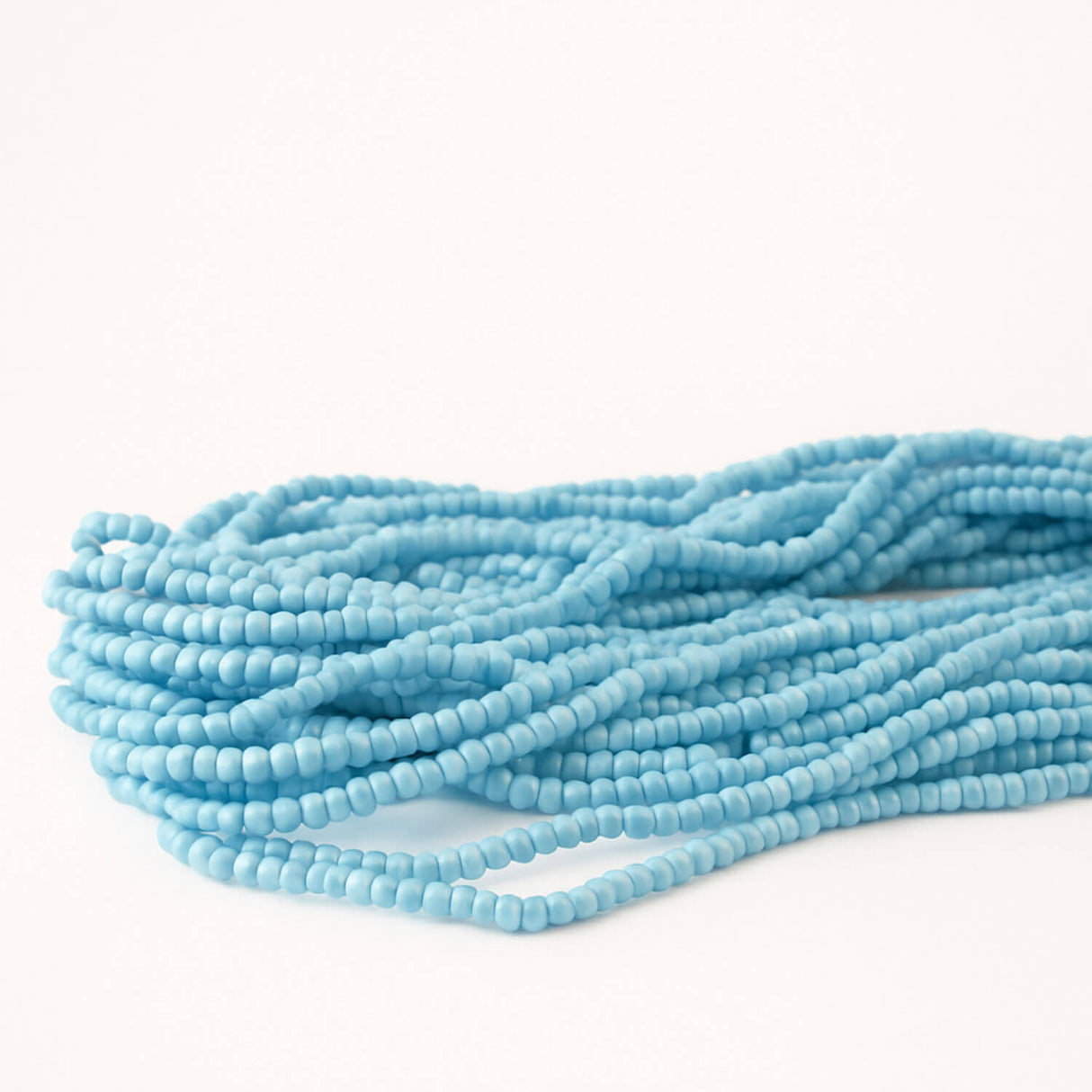 turquoise blue multi-strand necklace close up at lottie of london