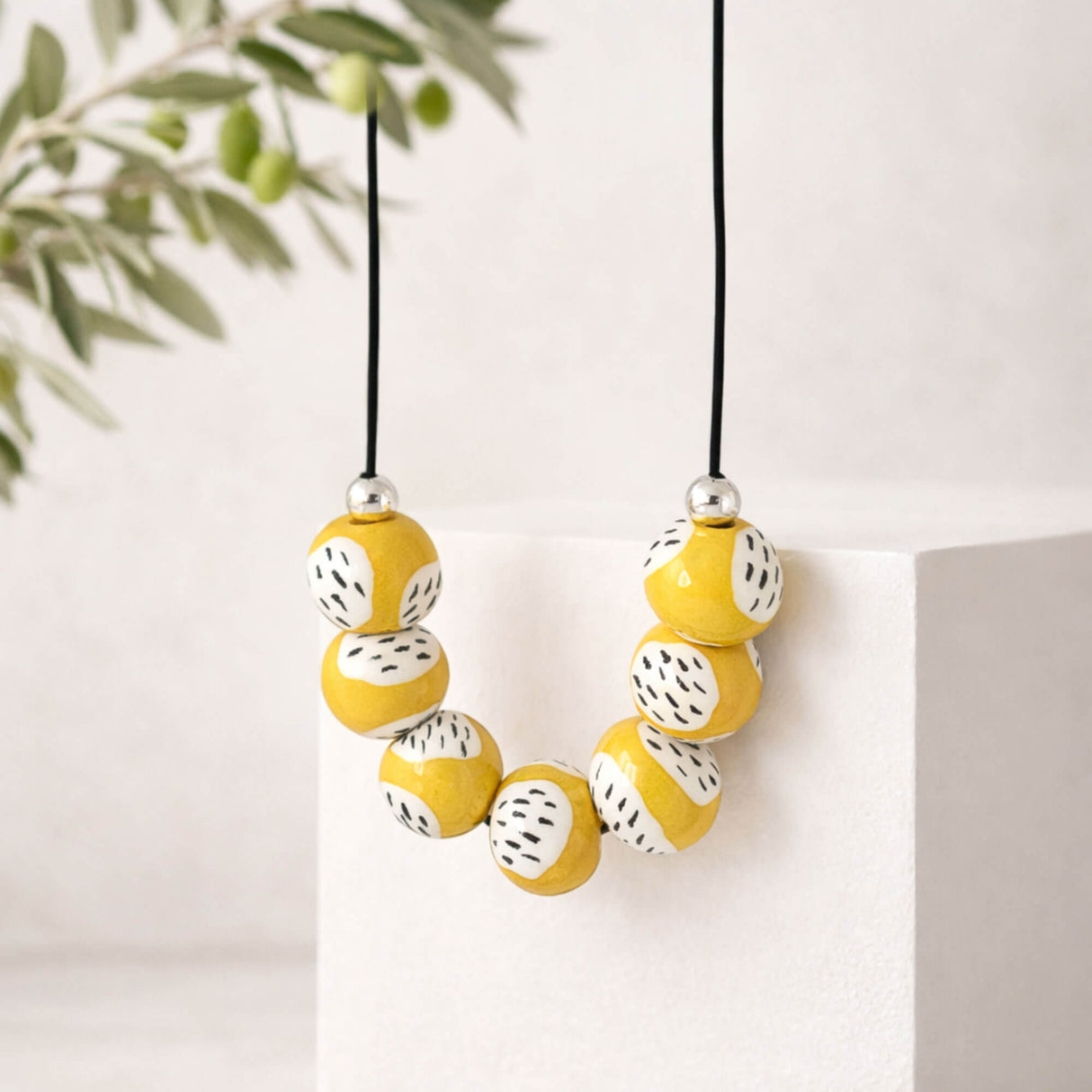 yellow clay bead necklace, handmade  jewellery at lottie of london, lifestyle image